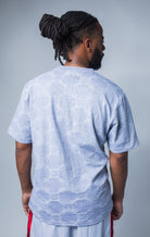 grey all-over tonal embossed pattern, short sleeve t-shirt with Makobi embroidery on upper back
