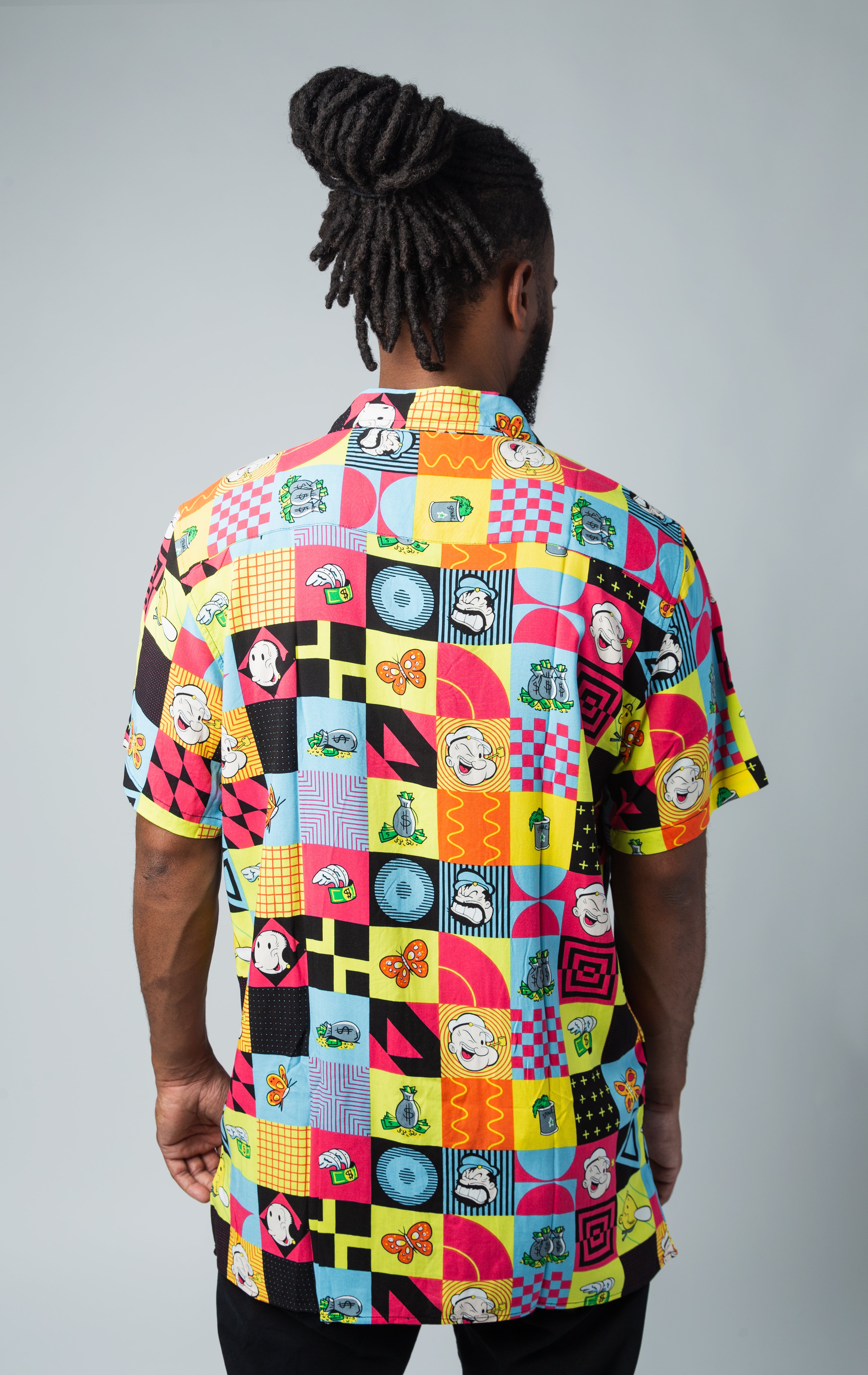 Back side of colorful short sleeve viscose button- down shirt with Popeye all over print 