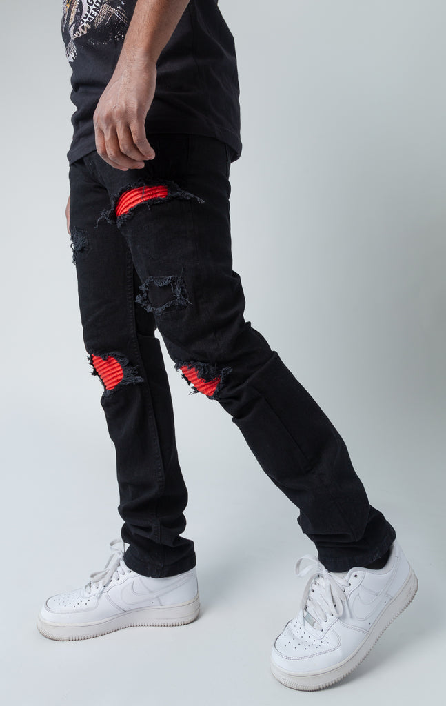 Evolution teared denim pants in black and red
