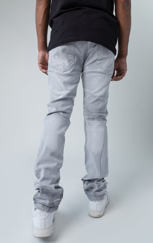 Back side of evolution teared denim pants in grey and white