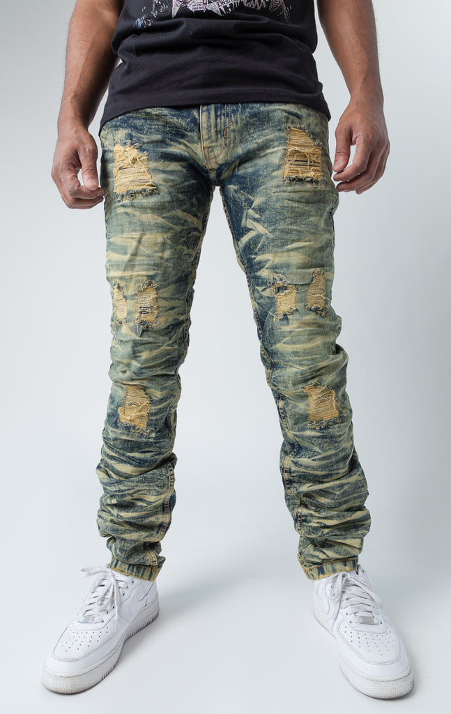 Tinted ripped low-waisted slim jeans.