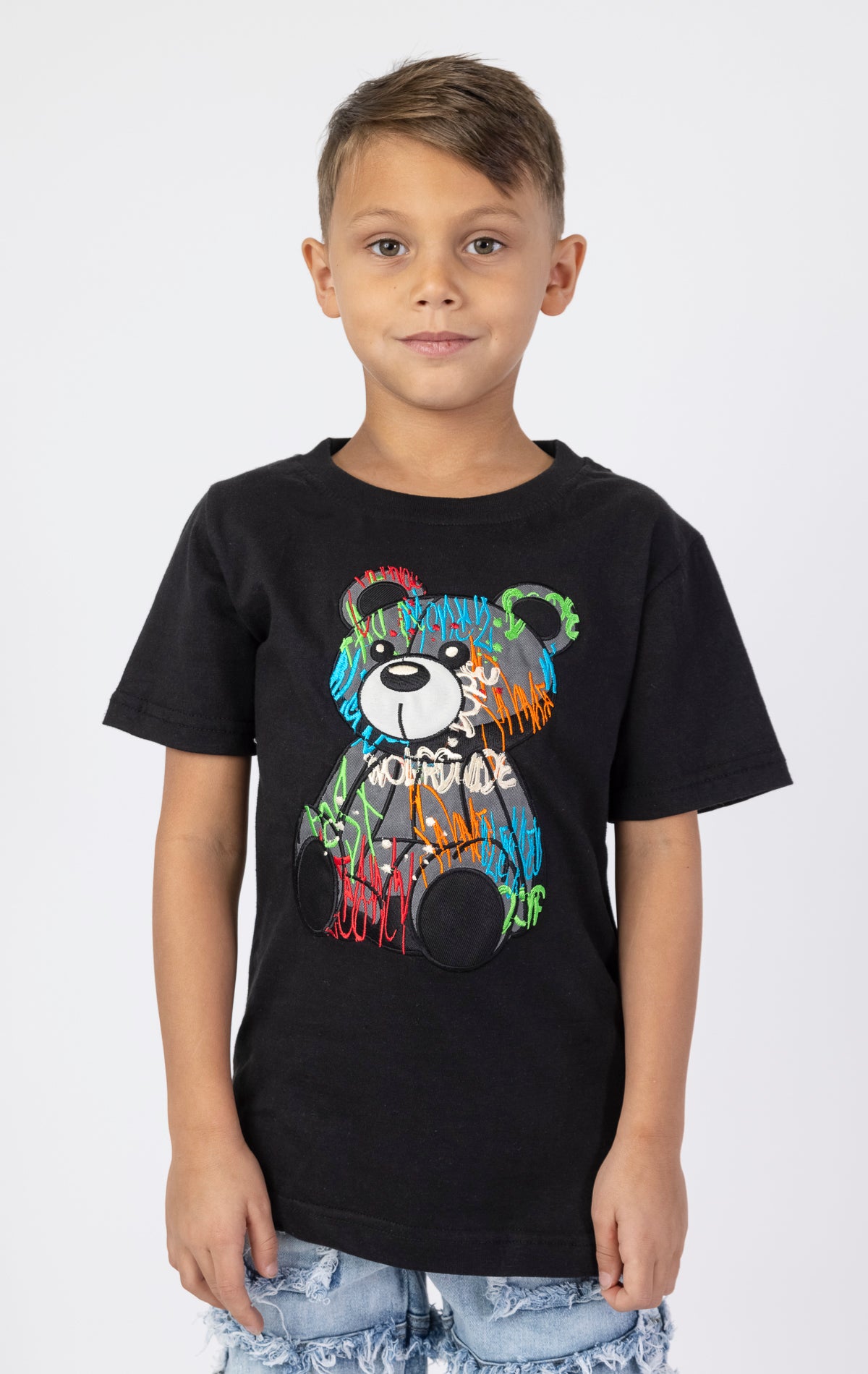 Graffiti Bear Tee. Black crewneck t-shirt with a front embroidered patch of a sitting bear in graffiti-inspired colors. Made from 100% cotton.