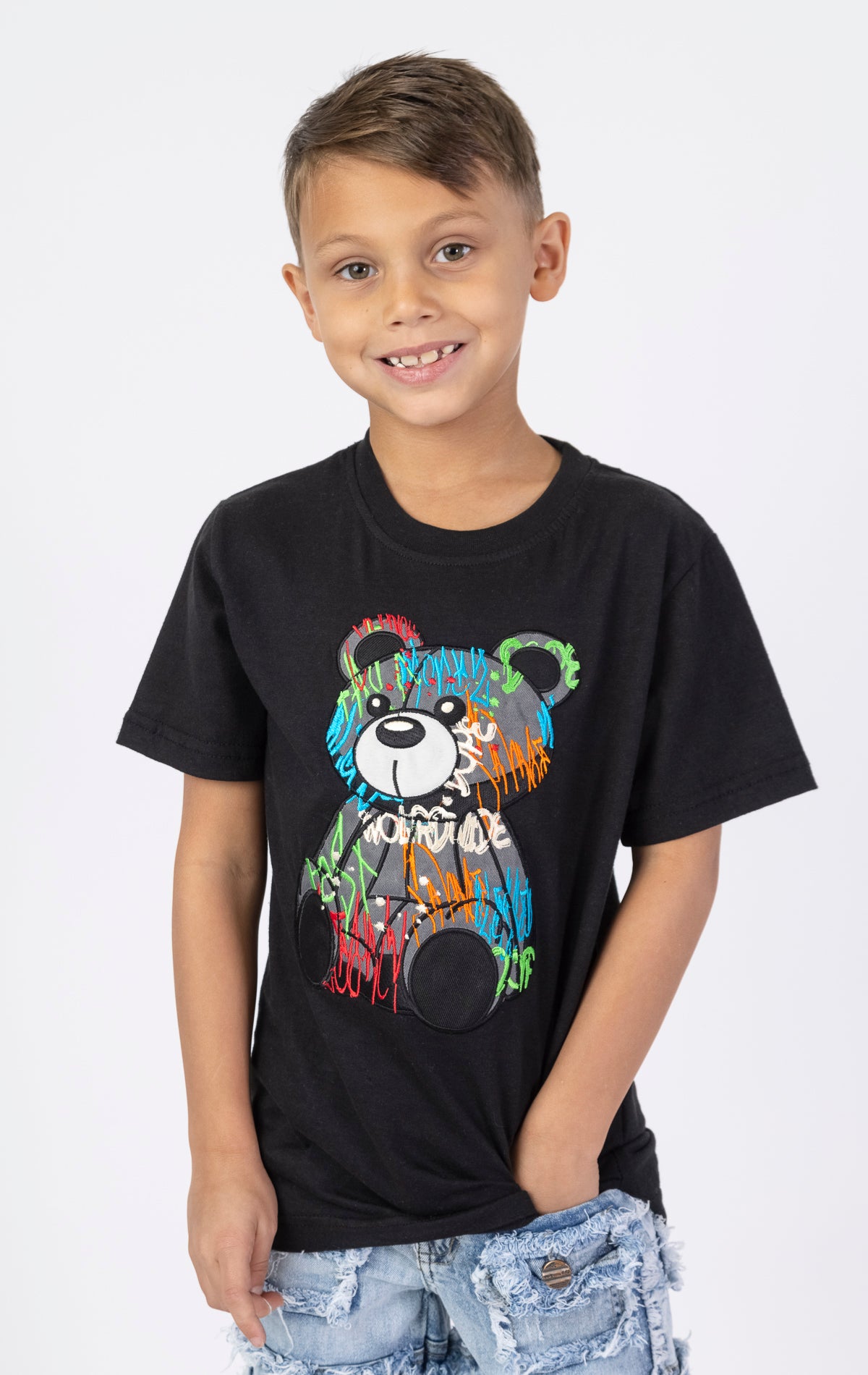 Graffiti Bear Tee. Black crewneck t-shirt with a front embroidered patch of a sitting bear in graffiti-inspired colors. Made from 100% cotton.