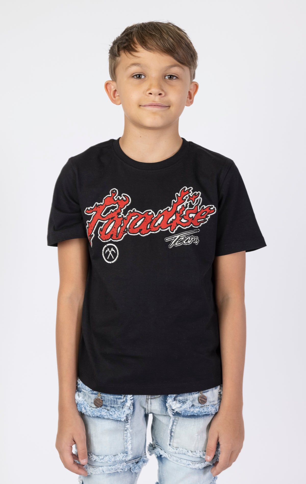 Kids Paradise Tour T-shirt. Features a classic crewneck, short sleeves, and screen-printed graphics on the front and back. Made from premium 220 GSM cotton for a soft and comfortable feel.