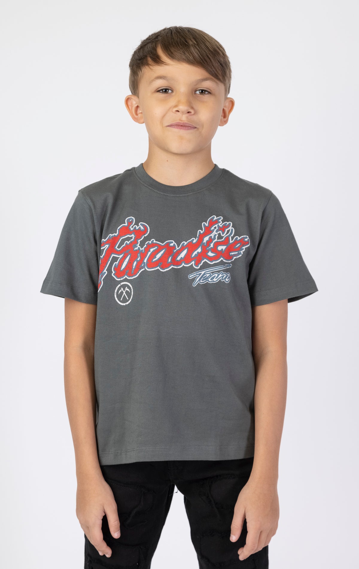 Kids Paradise Tour T-shirt. Features a classic crewneck, short sleeves, and screen-printed graphics on the front and back. Made from premium 220 GSM cotton for a soft and comfortable feel.