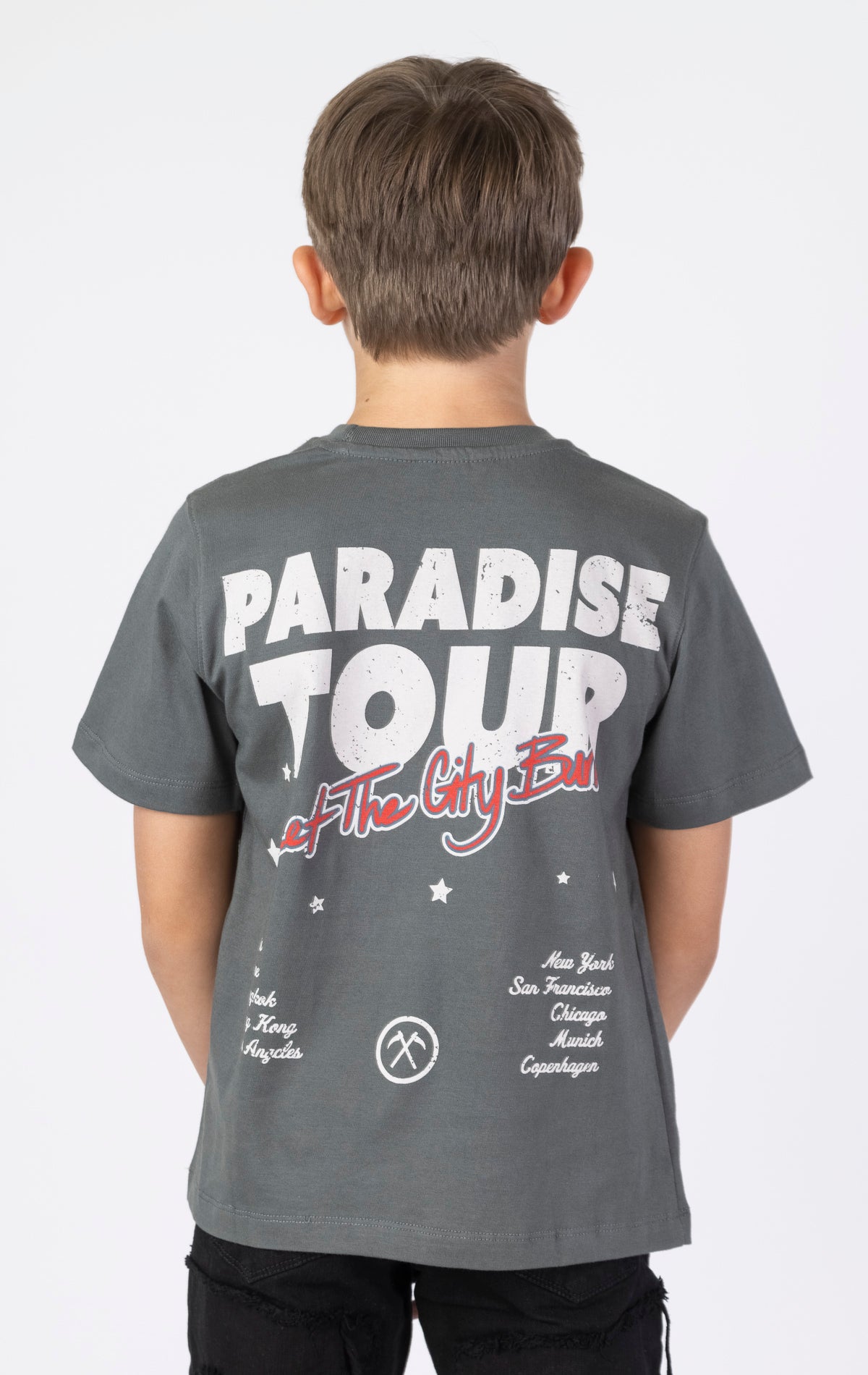 Kids Paradise Tour T-shirt. Features a classic crewneck, short sleeves, and screen-printed graphics on the front and back. Made from premium 220 GSM cotton for a soft and comfortable feel.