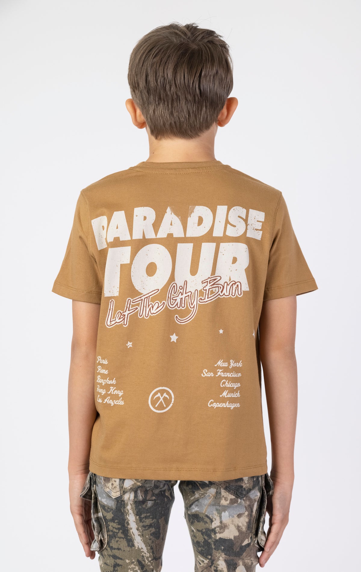 Kids Paradise Tour T-shirt. Features a classic crewneck, short sleeves, and screen-printed graphics on the front and back. Made from premium 220 GSM cotton for a soft and comfortable feel.