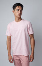 pink all-over tonal embossed pattern, short sleeve t-shirt with logo hardware on left side of chest