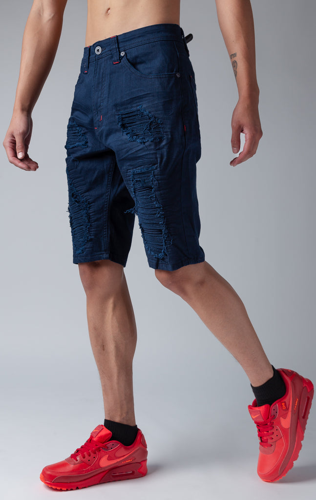 Navy denim shredded shorts with fused shreds, crinkle effect through out