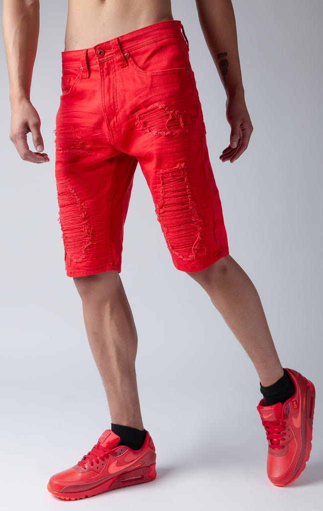 Red denim shredded shorts with fused shreds, crinkle effect through out