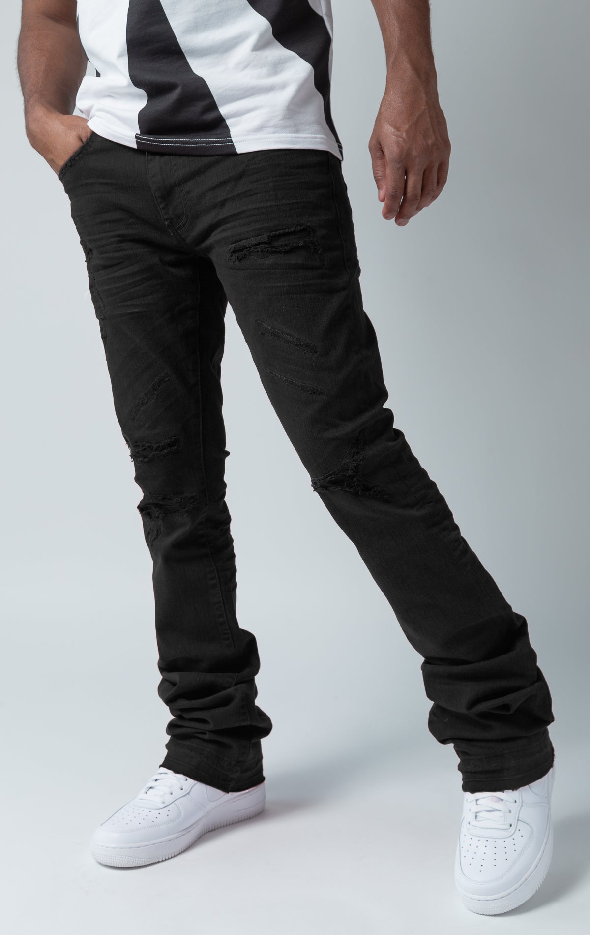 black stacked denim with ripped design 