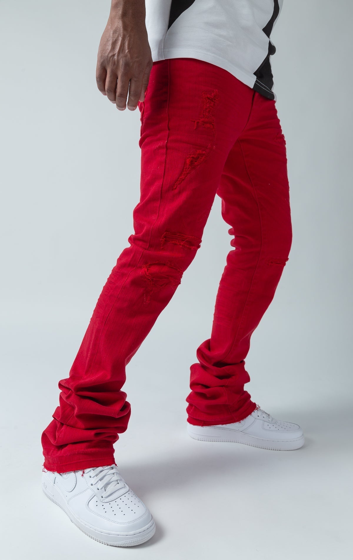 red stacked denim with ripped design