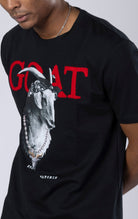 Goat Graphic Tee. Features a bold goat graphic, short sleeves, and a ribbed crewneck collar. Made from soft cotton