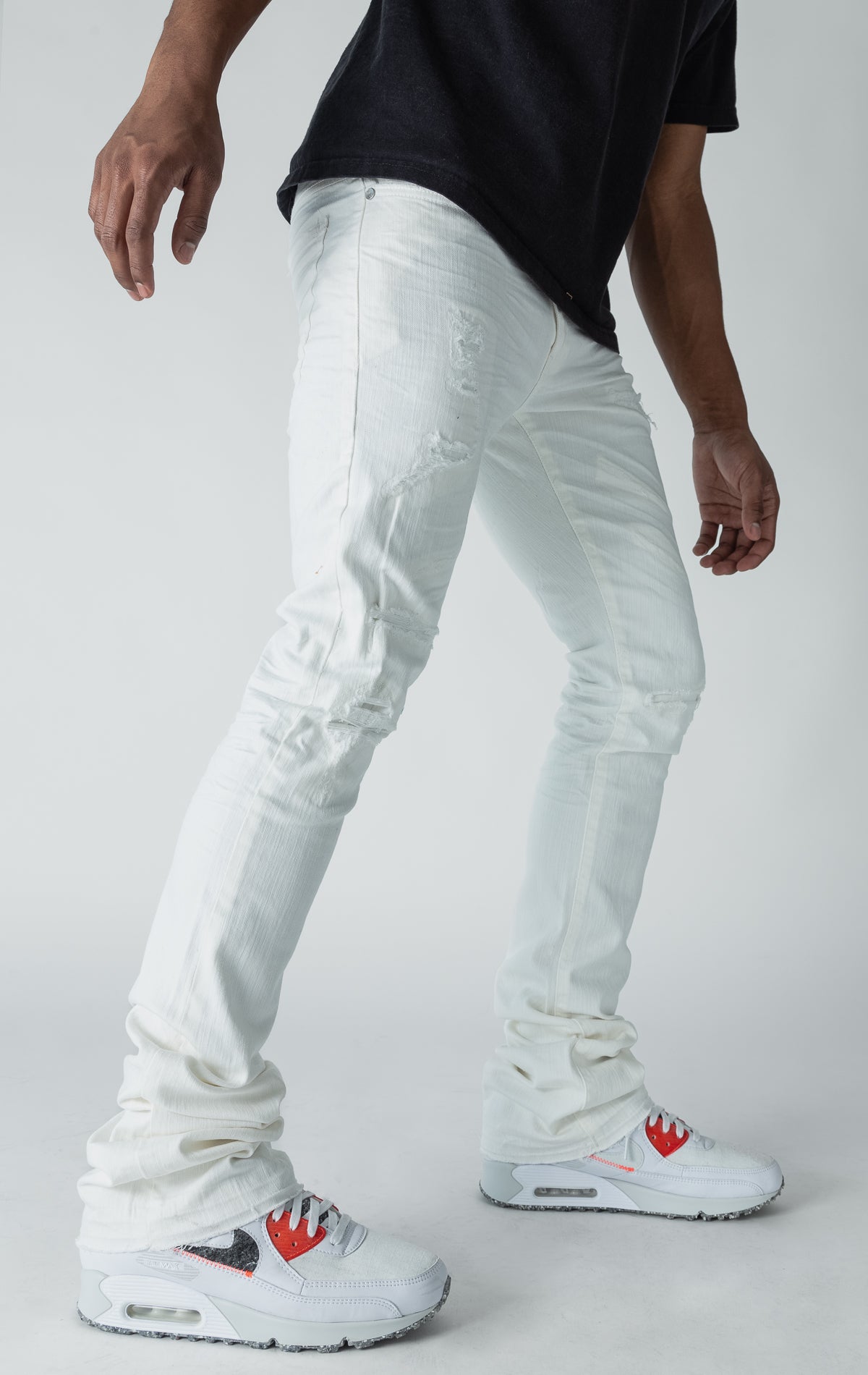 white stacked denim with ripped design