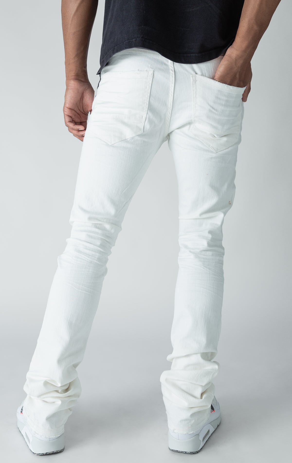 white stacked denim with ripped design