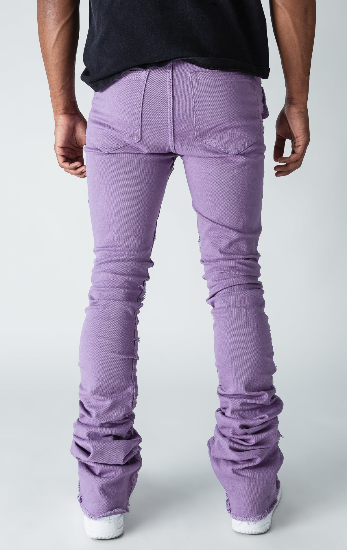 Purple patterned stitched, flared denim stacked jeans.