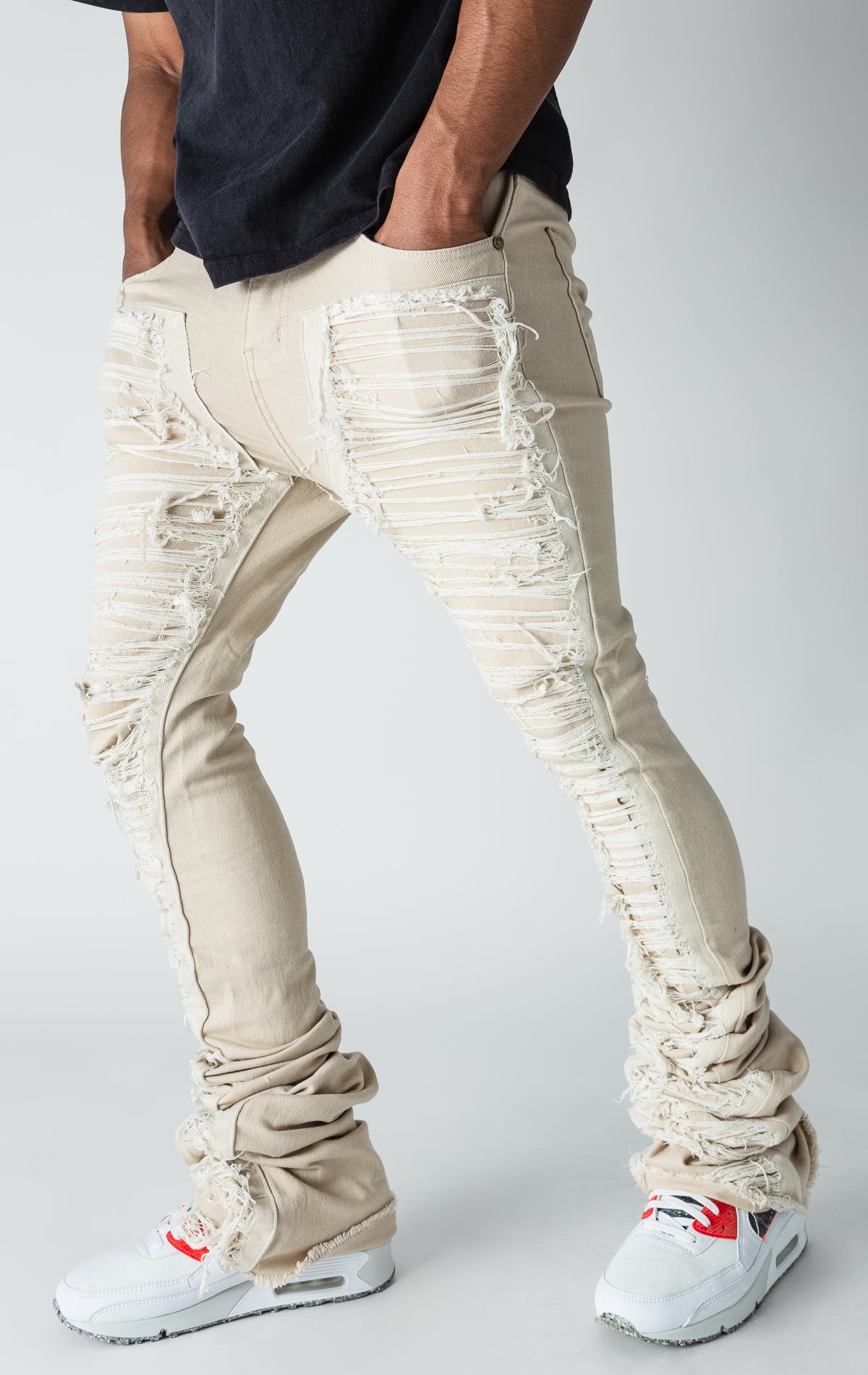 Khaki patterned stitched, flared denim jeans.