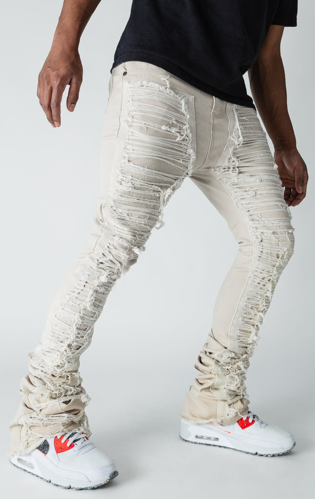 Khaki patterned stitched, flared denim jeans.