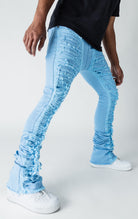 Baby Blue patterned stitched, flared denim stacked jeans.