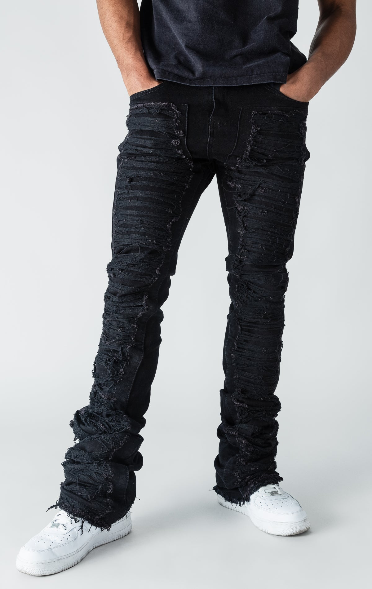 Black patterned stitched, flared denim stacked jeans.