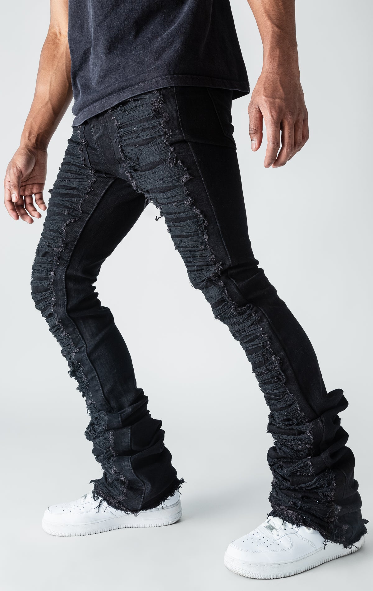 Black patterned stitched, flared denim stacked jeans.