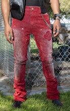 Red Skinny Jeans. Made from a stretchy denim blend. Features a tapered fit, side pockets, back pockets, and subtle embroidery.