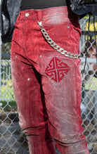 Red Skinny Jeans. Made from a stretchy denim blend. Features a tapered fit, side pockets, back pockets, and subtle embroidery.