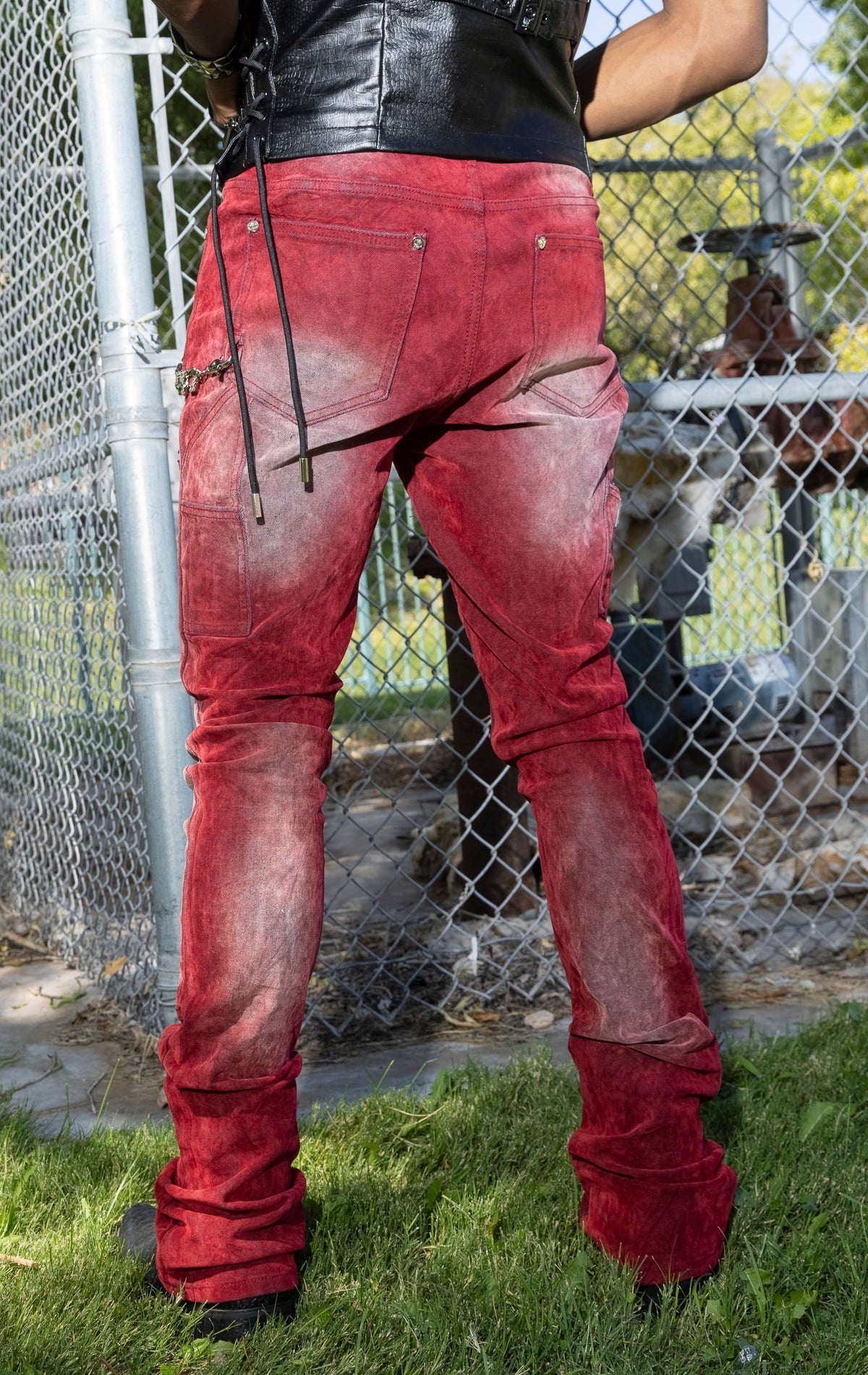 Red Skinny Jeans. Made from a stretchy denim blend. Features a tapered fit, side pockets, back pockets, and subtle embroidery.