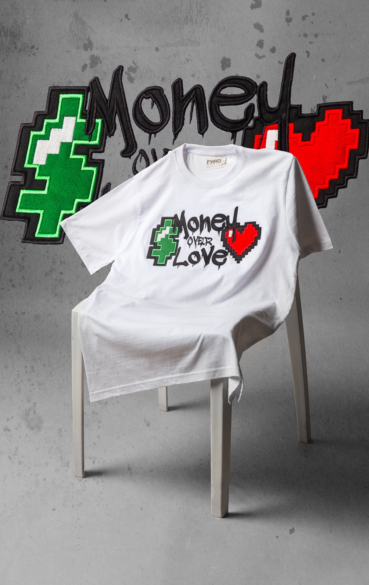 White t shirt with "Money over love" graphic