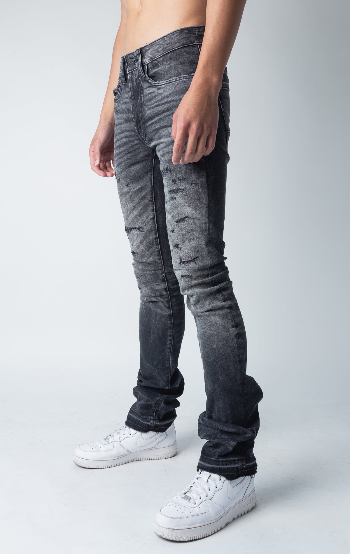 black shadow jeans with 3D wrinkles, rip and repair design