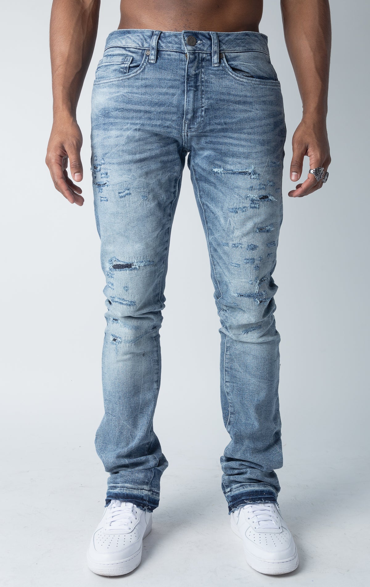 True blue jeans  with 3D wrinkles, rip and repair design