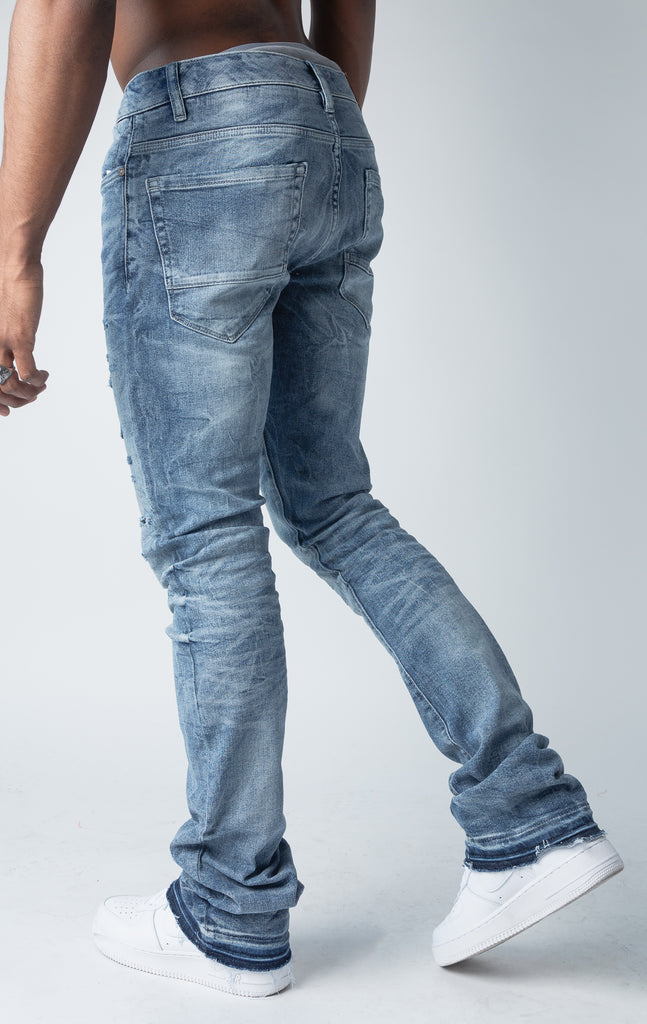 True blue jeans with 3D wrinkles, rip and repair design