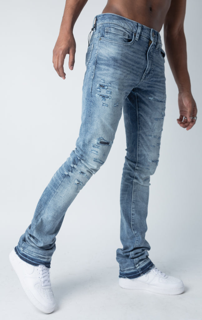 True blue jeans with 3D wrinkles, rip and repair design