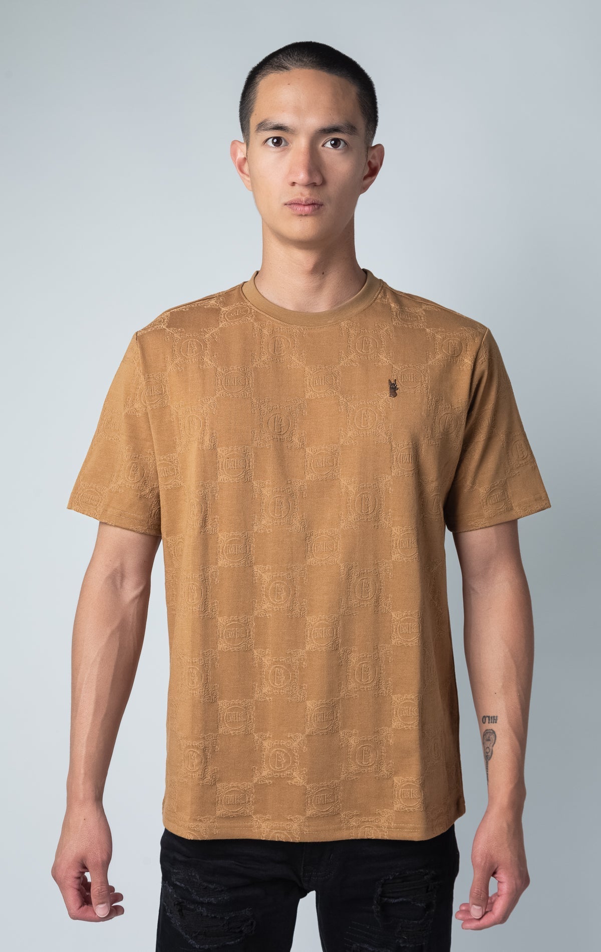 mocha all-over tonal embossed pattern, short sleeve t-shirt with logo hardware on left side of chest