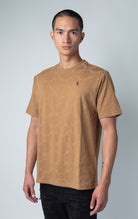 mocha all-over tonal embossed pattern, short sleeve t-shirt with logo hardware on left side of chest