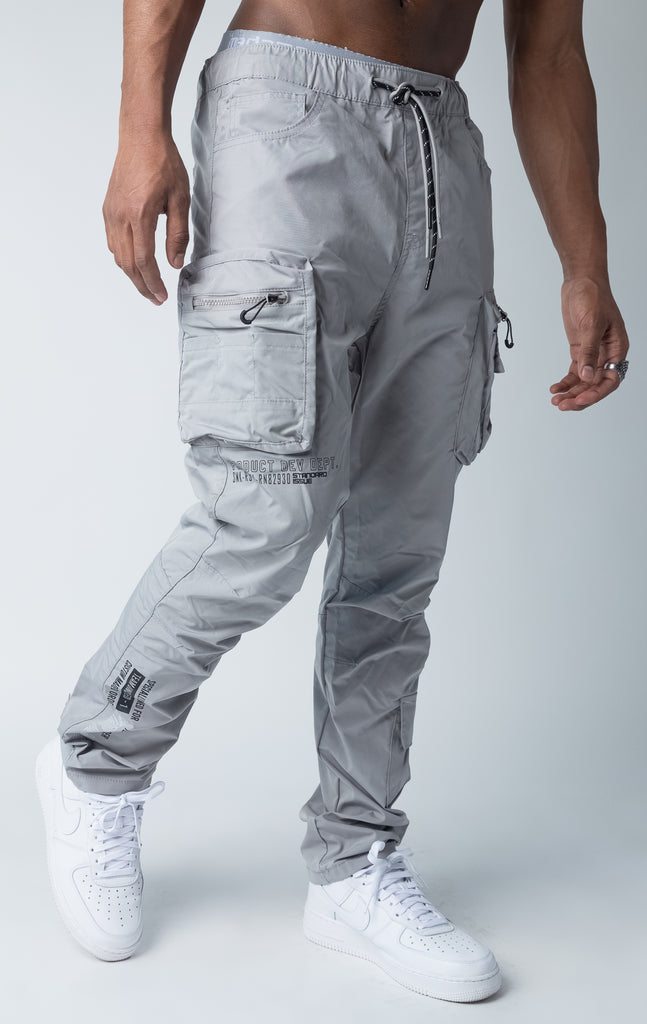 Grey windbreaker utility pants, sleek fit with an open bottom jogger style