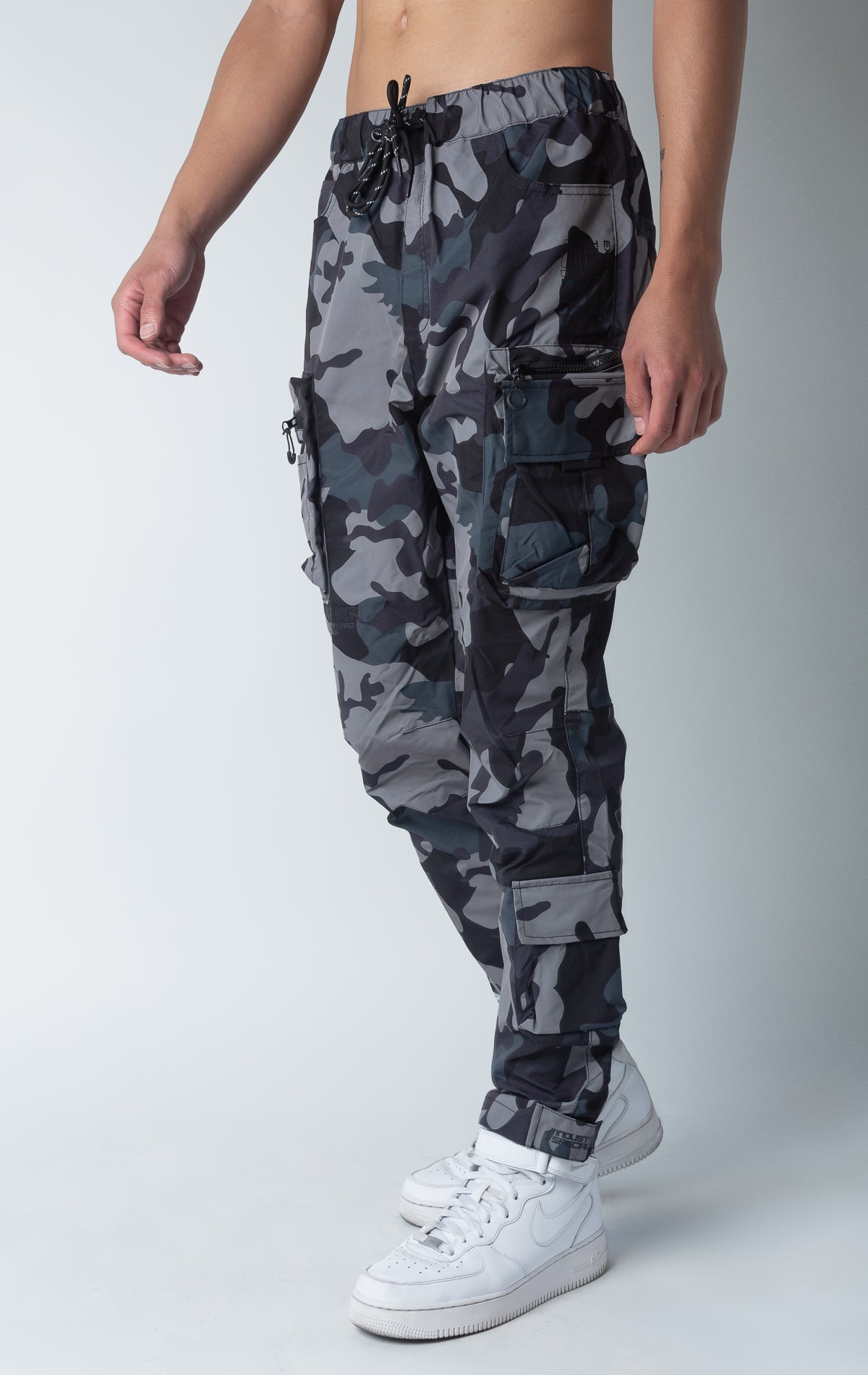 Camo windbreaker utility pants, sleek fit with an open bottom jogger style