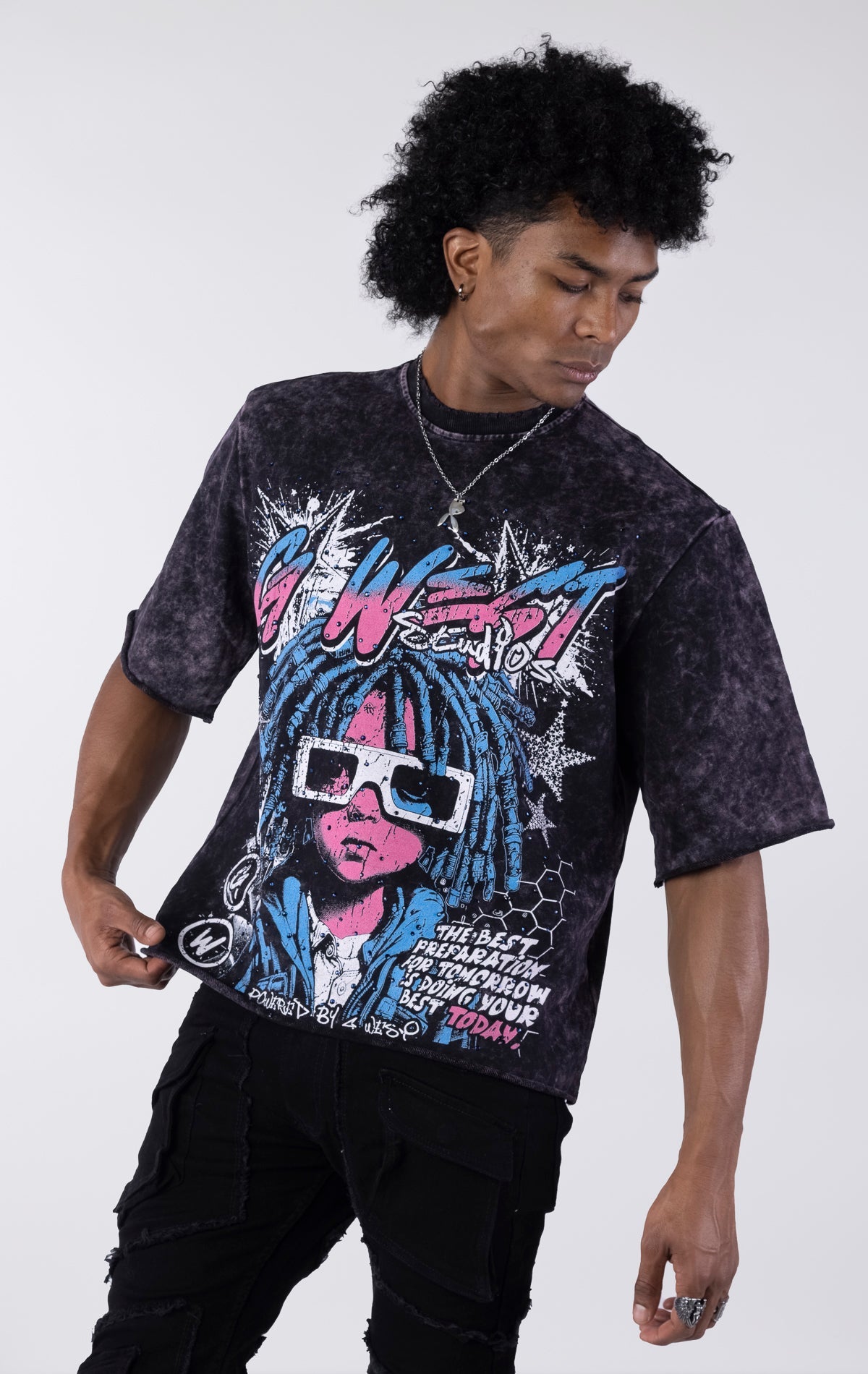 Person wearing a graphic t-shirt with colorful design on a white background