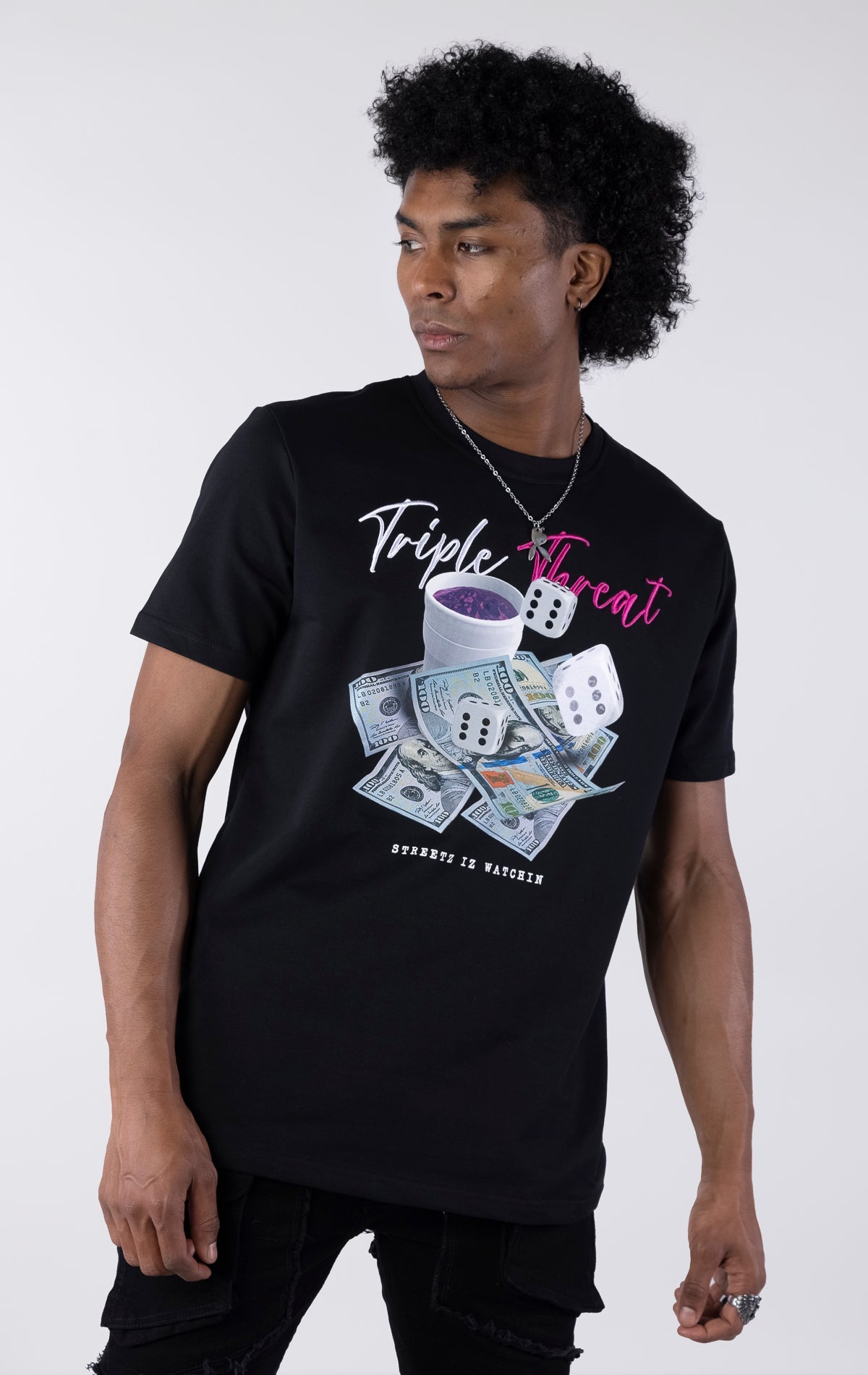 Black t-shirt with a detailed graphic featuring a pile of $100 bills, two dice, and a white cup with purple liquid. The text "Triple Threat" is printed above the image in white and pink script.