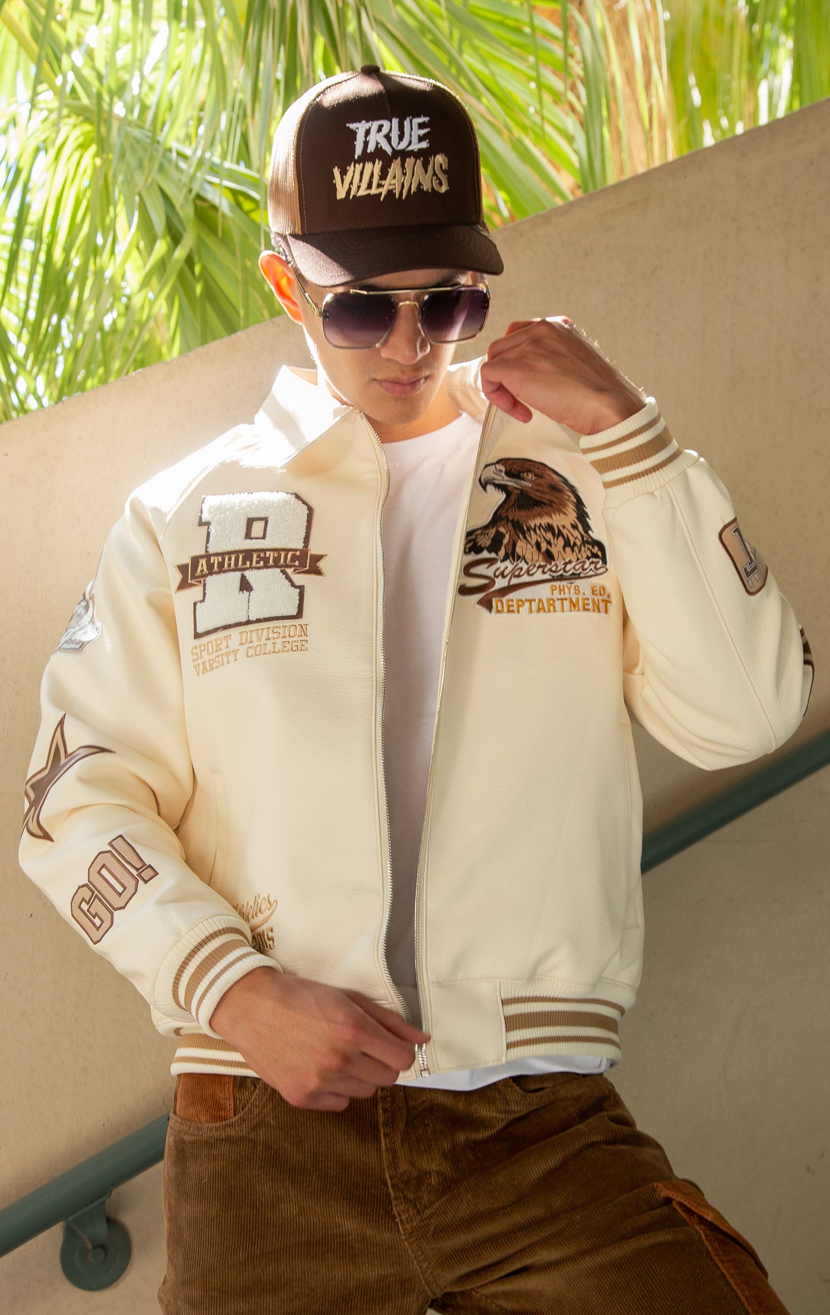 Cream U.S.A. Varsity Jacket with patches, zip-up front, and quilted lining