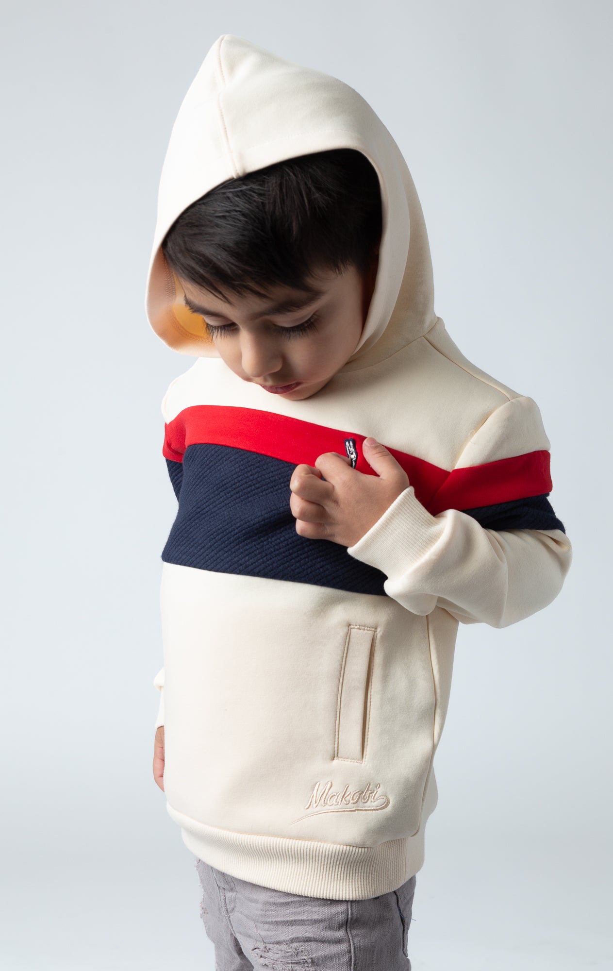 Made from soft and cozy fabric. Monogram kid's hoodie in natural navy and red