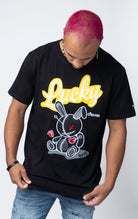 Lucky Charm bunny patch t-shirt in black with a gold slogan on front
