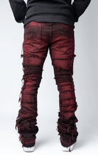 Magma distressed and stacked flare jeans featuring an ombre wash and ripped details