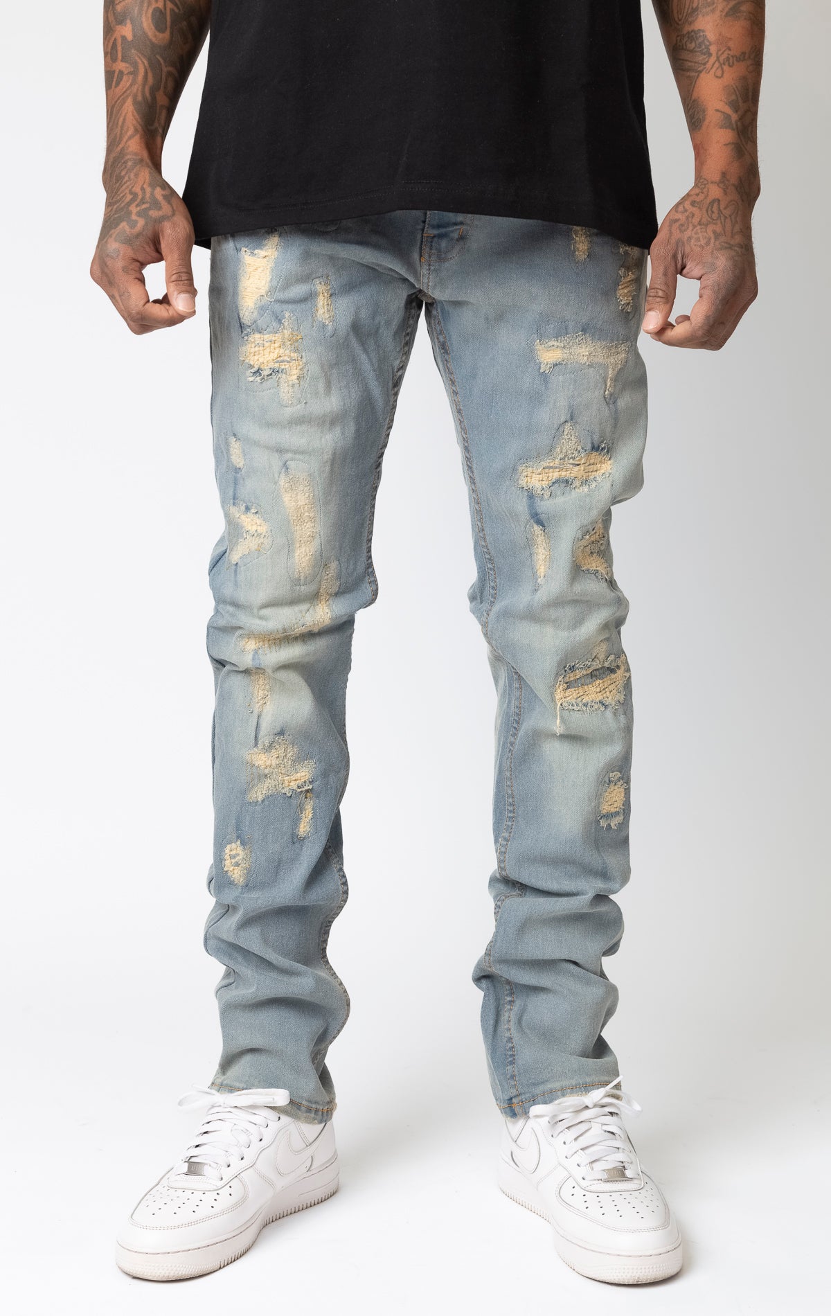 Light tint Frayed rip and repair slim fit denim jeans