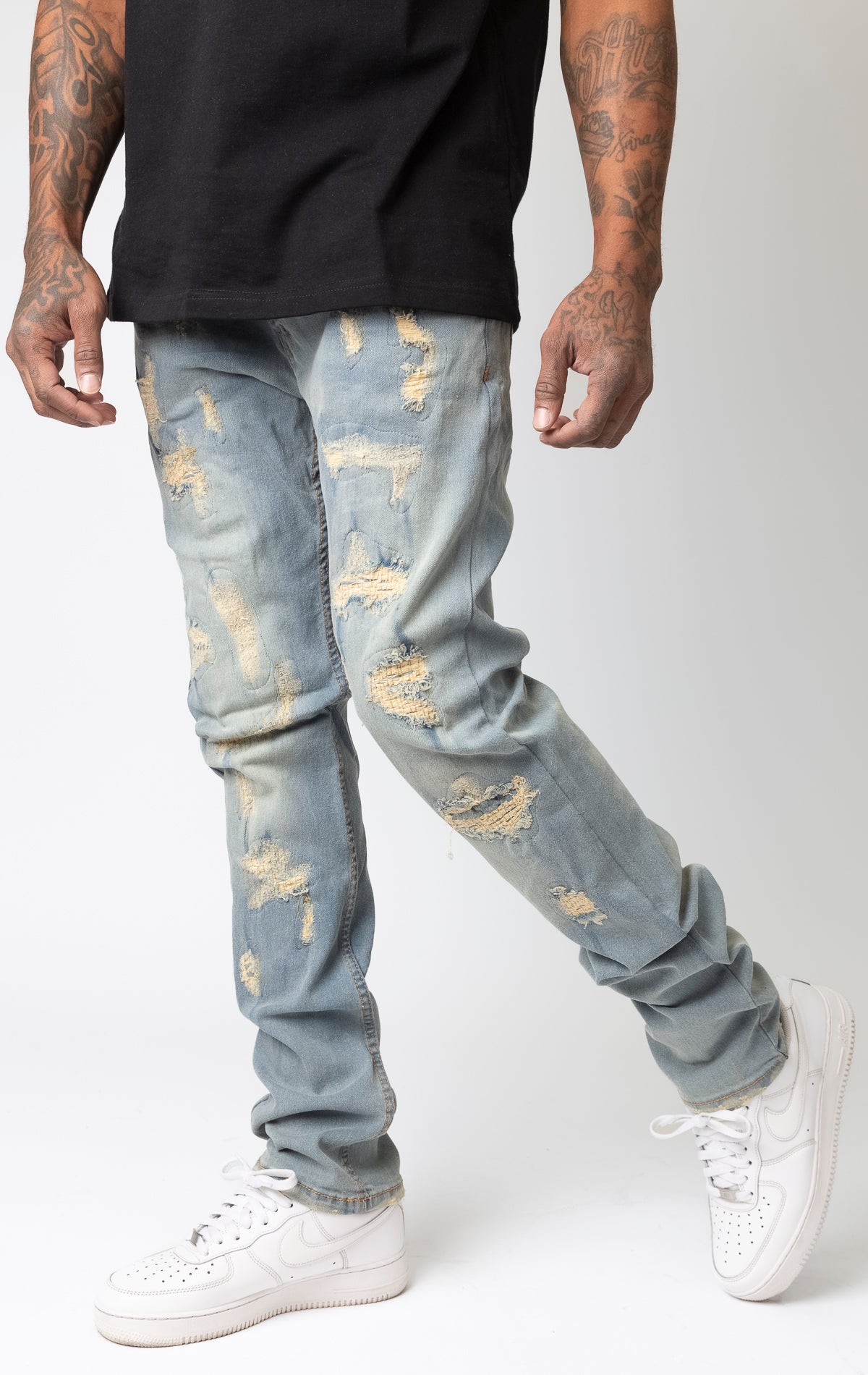 Light tint Frayed rip and repair slim fit denim jeans