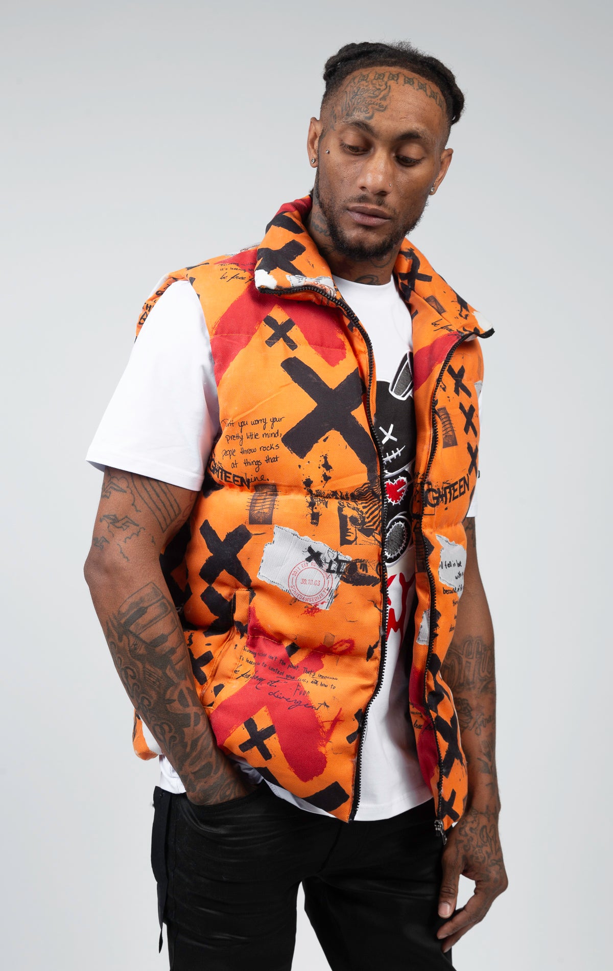 An orange stylish and functional puffer vest with stand-up collar, and full zip closure.