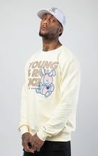 Off white stylish and comfortable sweatshirt featuring a vibrant lucky charm bunny print and an empowering 'Young, Rich, and Lucky' slogan.