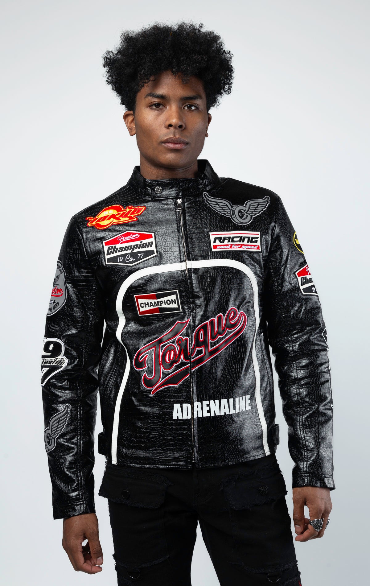 Black Leather motorcycle jacket featuring a bold "Speedster" graphic on the back. This varsity style jacket includes ribbed cuffs and collar, and a sleek silver zipper closure