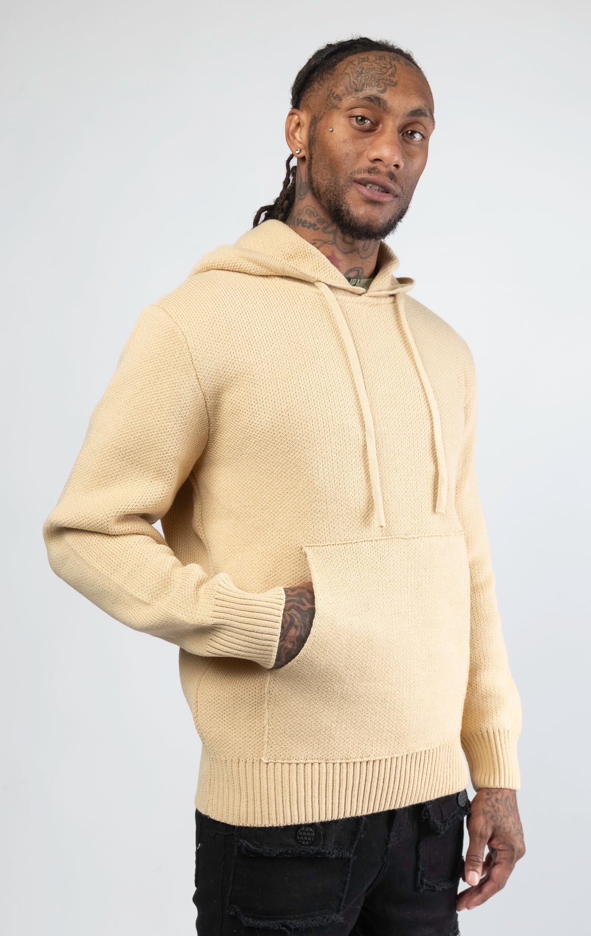 A stylish and comfortable Knitted Jersey Hooded Sweater in sand color, featuring a relaxed fit, a hood, and luxuriously soft knitted jersey fabric.
