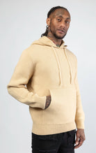 A stylish and comfortable Knitted Jersey Hooded Sweater in sand color, featuring a relaxed fit, a hood, and luxuriously soft knitted jersey fabric.